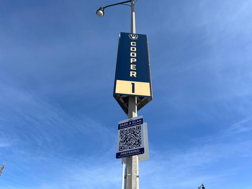 American Family Field parking lots now include signs with QR codes to pay for parking using the new parking payment system.