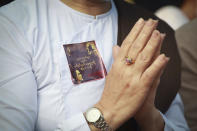 A Buddhist prays outside Aung San Suu Kyi's residence in Yangon, Myanmar, Friday, Feb. 26, 2021. Social media giant Facebook announced Thursday it was banning all accounts linked to Myanmar's military as well as ads from military-controlled companies in the wake of the army's seizure of power on Feb. 1. (AP Photo)