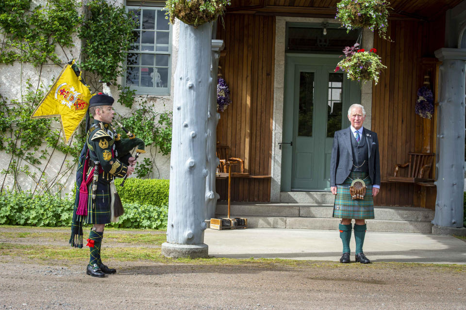 Handout photo issued by Poppy Scotland of the Prince of Wales, known as the Duke of Rothesay when in Scotland, taking a salute as a piper plays during a St Valery commemoration at his Birkhall residence in Scotland. The ceremony is to commemorate the thousands of Scots who were killed or captured during "the forgotten Dunkirk" 80 years ago. Issue date: Friday June 12, 2020. The Second World War battle led to 10,000 mainly Scottish soldiers from the 51st Highland Division being captured at St Valery-en-Caux in France. See PA story ROYAL Pipers. Photo credit should read: Mark Owens/Poppyscotland/PA Wire NOTE TO EDITORS: This handout photo may only be used in for editorial reporting purposes for the contemporaneous illustration of events, things or the people in the image or facts mentioned in the caption. Reuse of the picture may require further permission from the copyright holder.