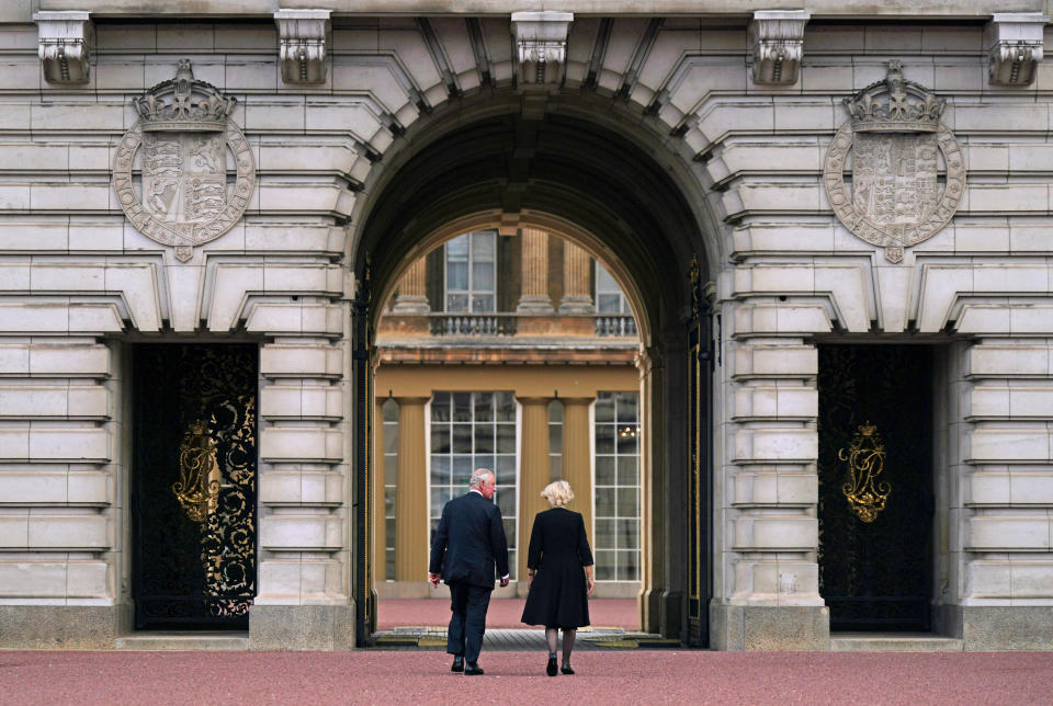 King Charles III and the Queen walk across the forecourt of Buckingham Palace, London, as he enters the palace for the first time as the new King after travelling from Balmoral following the death of Queen Elizabeth II on Thursday. Picture date: Friday September 9, 2022.