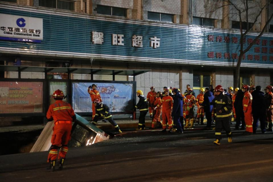 At least six people are dead after a bus plunged into a sinkhole in northwestern China. Source: Ma Minyan/cnsphoto via AP