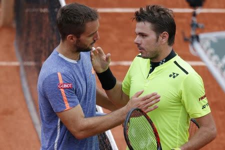 Tennis - French Open - Roland Garros - Viktor Troicki of Serbia v Stan Wawrinka of Switzerland - Paris, France - 29/05/16. Wawrinka shakes hands with Troicki at the end of their match. REUTERS/Gonzalo Fuentes