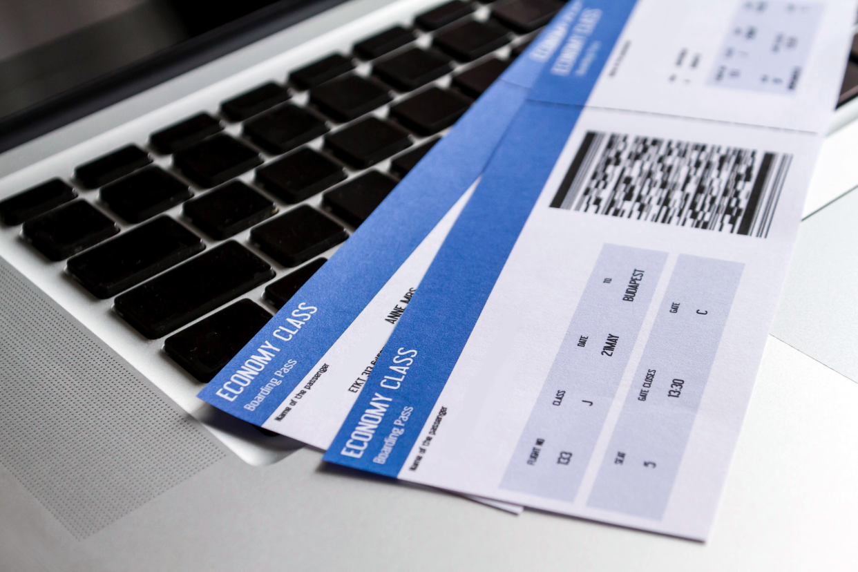 Airplane tickets on a laptop