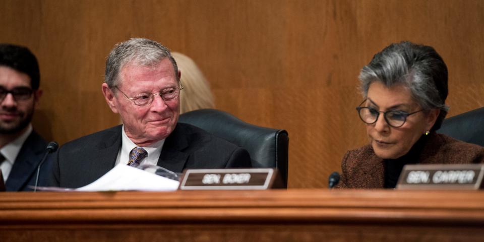 Inhofe and then-ranking member Democratic Sen. Barbara Boxer of California at a Senate Environment and Public Works Committee hearing in January 2015.