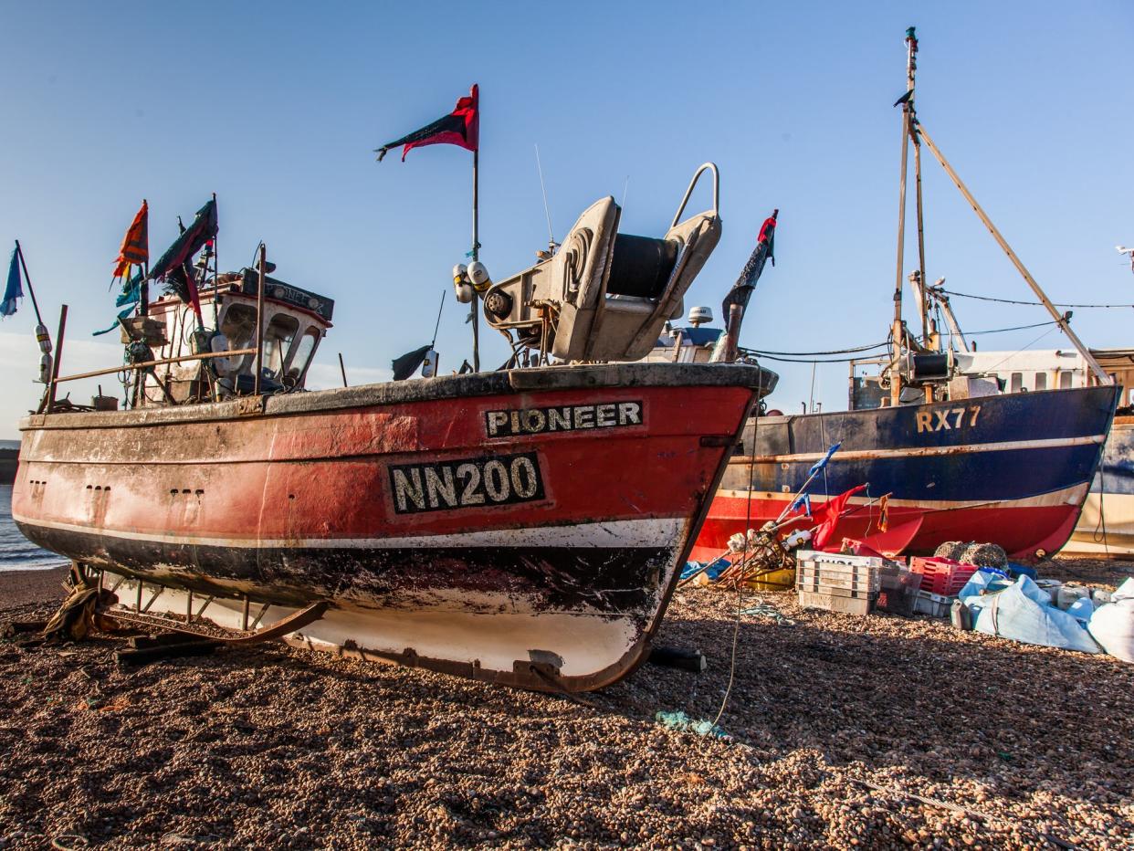 Fishing boats out of the water in Hastings - the town is home to Europe's largest beach-launched fishing fleet: Getty