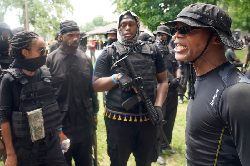 Members and supporters of an all-Black militia group called NFAC hold an armed rally in Louisville