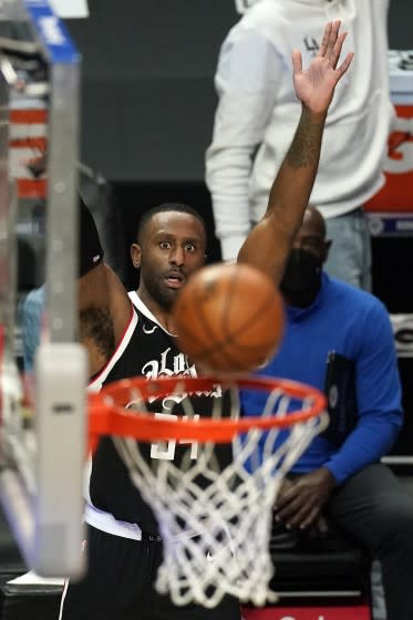 Clippers forward Patrick Patterson watches his three-point shot go through the hoop.