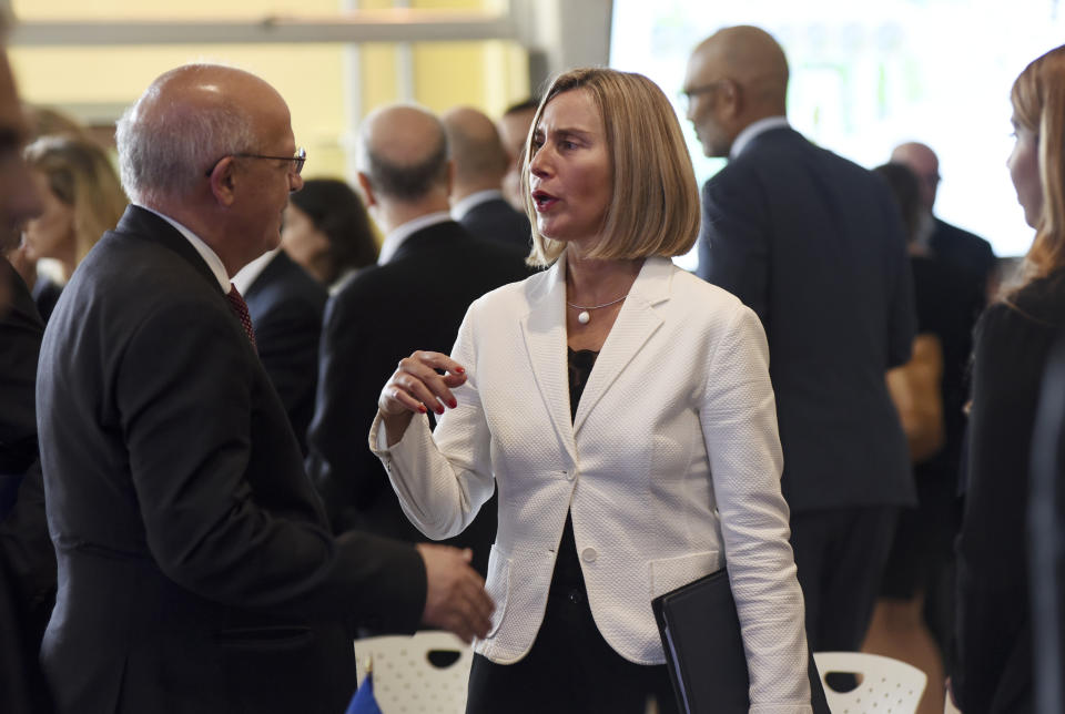 European Union foreign policy chief Federica Mogherini, right, talks to Portugal's Foreign Minister Augusto Santos Silva, after of a press conference in San Jose, Costa Rica, Tuesday, May 7, 2019. Mogherini made the announcement that a mostly European group of nations will send a high-level delegation to Venezuela to propose solutions to that country's protracted crisis. (AP Photo/Carlos Gonzalez )