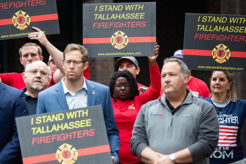 Tallahassee firefighters hold a press conference in front of City Hall demanding fair wages Wednesday, Nov. 15, 2023.