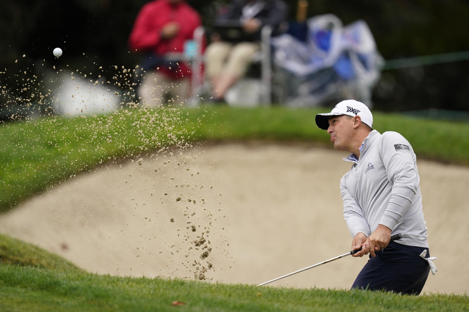 Justin Lower hits out of a bunker onto the sixth green of the Silverado Resort North Course during the final round of the Fortinet Championship PGA golf tournament in Napa, Calif., Sunday, Sept. 18, 2022. (AP Photo/Eric Risberg)