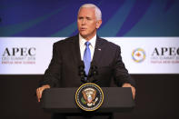 U.S. Vice President Mike Pence speaks at the APEC CEO Summit at the Pacific Explorer cruise ship docked in Port Moresby, Papua New Guinea, Saturday, Nov. 17, 2018. (AP Photo/Mark Schiefelbein)