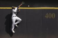 Milwaukee Brewers' Lorenzo Cain can't catch a grand slam hit by Atlanta Braves' Freddie Freeman during the seventh inning of a baseball game Sunday, May 16, 2021, in Milwaukee. (AP Photo/Morry Gash)