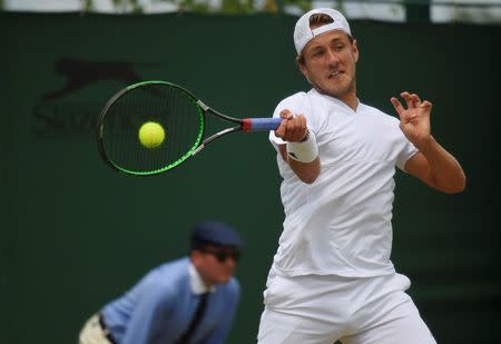 Britain Tennis - Wimbledon - All England Lawn Tennis & Croquet Club, Wimbledon, England - 3/7/16 France's Lucas Pouille in action against Argentina's Juan Martin Del Potro REUTERS/Toby Melville