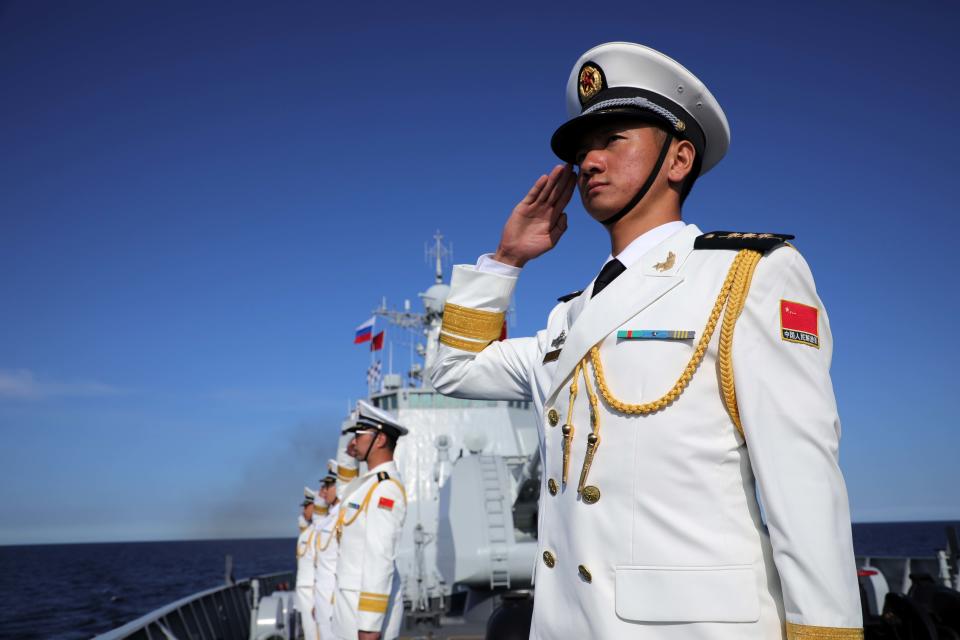 Sailors in full dress line up on the deck of Chinese missile destroyer Xi'an.