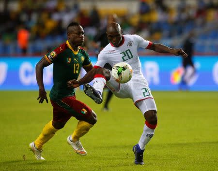 Football Soccer - African Cup of Nations - Burkina Faso v Cameroon - Stade de l'Amitie - Libreville, Gabon - 14/1/17. Cameroon's Christian Mougang Bassogog follows Burkina Faso's Yacouba Coulibaly. REUTERS/Mike Hutchings