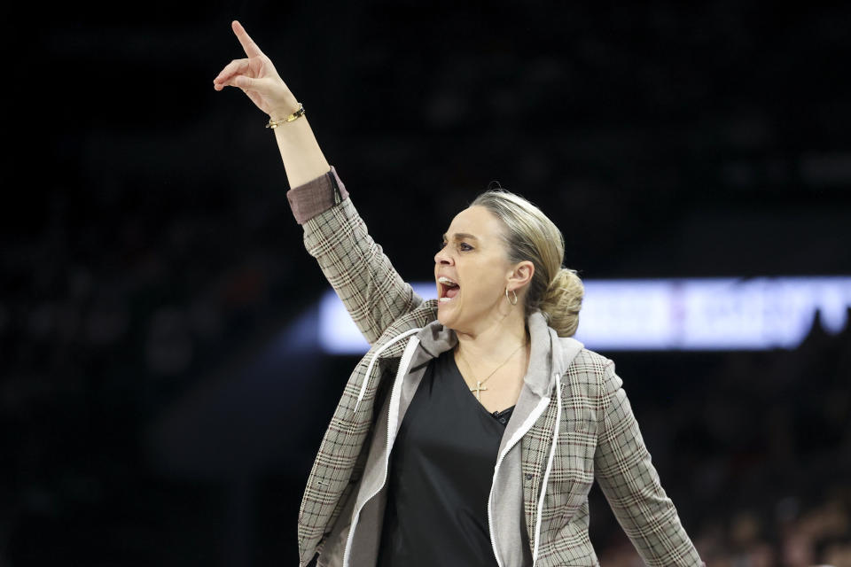 Las Vegas Aces head coach Becky Hammon yells during the first half of a WNBA Semifinal basketball game, Sunday, Oct. 6, 2024, in Las Vegas. (AP Photo/Ian Maule)