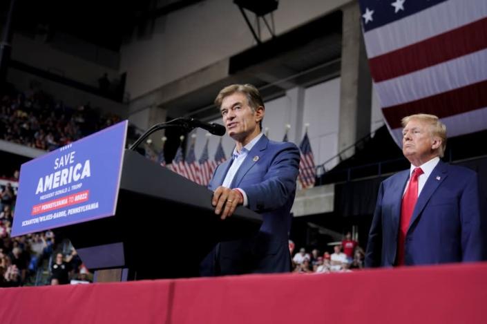 Pennsylvania Republican Senate candidate Mehmet Oz, left, is joined by former President Donald Trump at a rally in Wilkes-Barre, Pa., Saturday, Sept. 3, 2022. (AP Photo/Mary Altaffer)