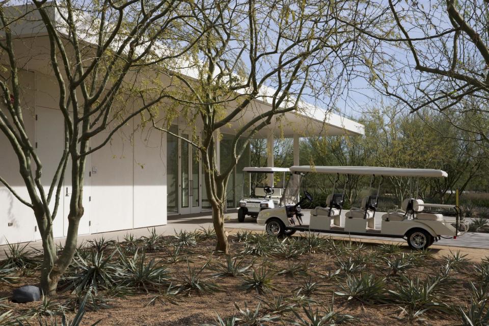 Golf carts await passengers at The Annenberg Retreat at Sunnylands, Rancho Mirage, Calif., where President Barack Obama is playing golf according to White House officials, on Saturday, Feb. 15, 2014. With two stays in less than a year at the sprawling Sunnylands estate in Southern California, President Barack Obama is helping to fulfill the dream of the late philanthropists Walter and Leonore Annenberg, who hoped the property they used as a winter home would become the “Camp David of the West.”(AP Photo/Jacquelyn Martin)