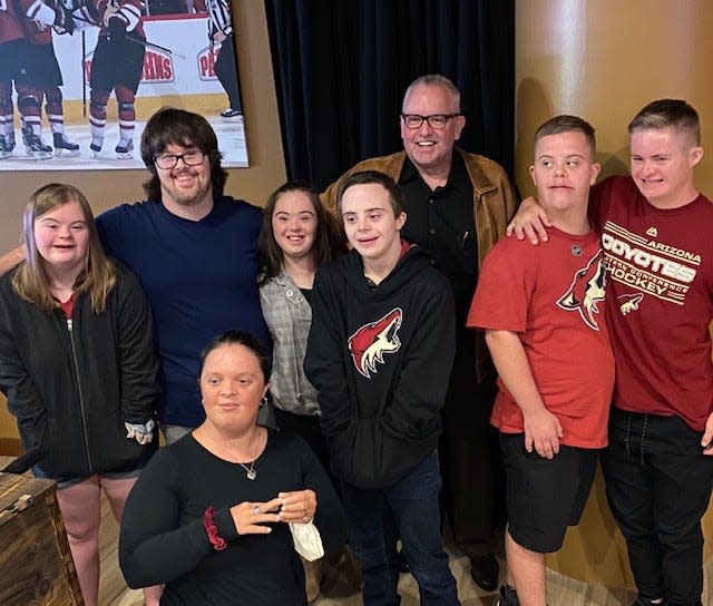 The six new greeters at Gila River Arena enjoy a Coyotes game with Angels For Higher founders Robert Hendershot and Trevor Hendershot.