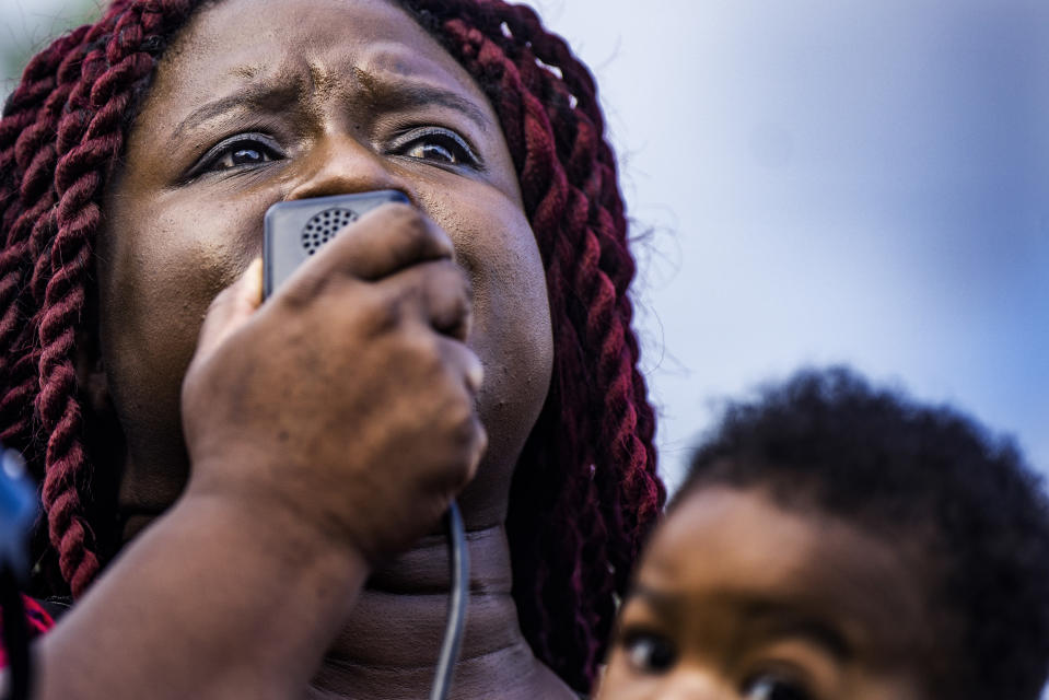 Nekima Levy-Pounds speaks during a vigil for William "Billy" Hughes on Monday, Aug. 6, 2018 in St. Paul, Minn. The Bureau of Criminal Apprehension said in a statement Tuesday, Aug. 7, that William James Hughes, 43, died of multiple gunshot wounds early Sunday after officers responded to a 911 call of multiple shots fired on the upper floor of the apartment building where he lived. (Richard Tsong-Taatarii/Star Tribune via AP) /Star Tribune via AP)