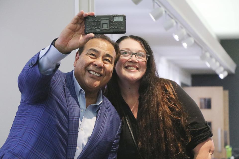 ABC News veteran and TV host John Quinones takes a selfie with a fan Thursday while visiting Sturgis as a guest of the Glen Oaks Community College's Viking Series program.
