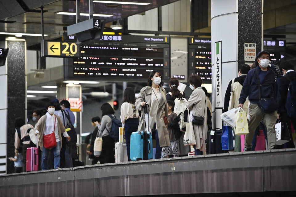 TOKYO, JAPAN - APRIL 29 :  Travellers are waiting for their Shinkansen bullet train on April 29, 2022 in Tokyo, Japan, as the 'Golden Week' a series of national holidays starts for a period of 7 days, from April 29 to May 5. During these days people generally desert the capital and part of the business in Japan will be closed. (Photo by David MAREUIL/Anadolu Agency via Getty Images)