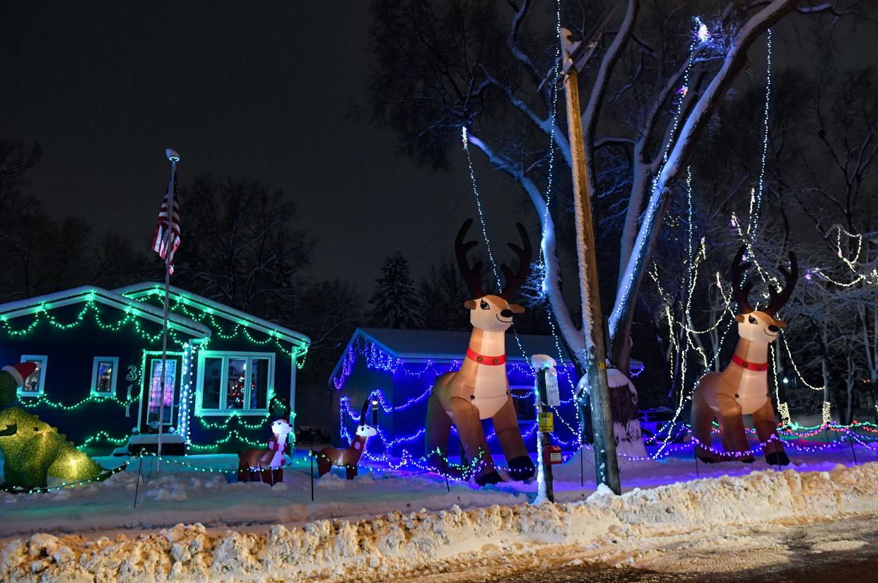 Lights and inflatables fill a front yard on Lotta Street on Friday, December 9, 2022, in Sioux Falls.