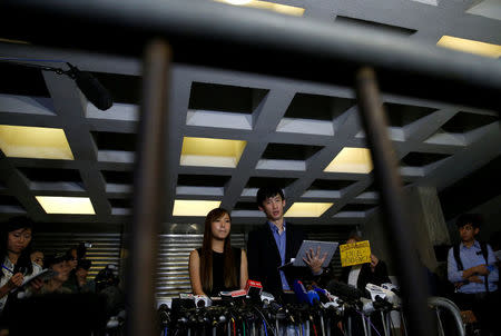 Democratically-elected legislators Yau Wai-Ching and Baggio Leung (3nd-R) speak to media after a High Court disqualified them from taking office in Hong Kong, China November 15, 2016. REUTERS/Tyrone Siu