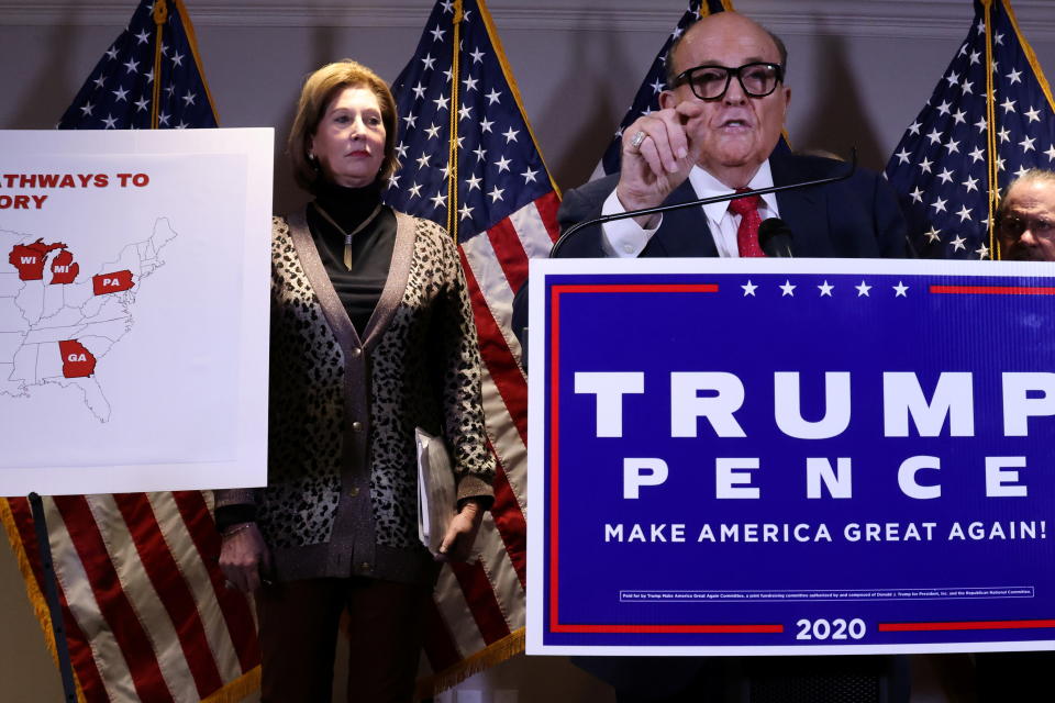 Sidney Powell, an attorney later disavowed by the Trump campaign, participates in a news conference with U.S. President Donald Trump's personal lawyer Rudy Giuliani at the Republican National Committee headquarters on Capitol Hill in Washington, U.S. November 19, 2020. Picture taken November 19, 2020.  REUTERS/Jonathan Ernst