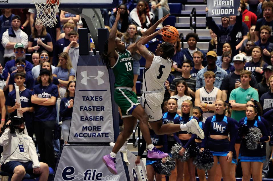 UNF forward Dorian James (5) goes against JU's Robert McCray V in their game on Jan. 12 at UNF Arena.
