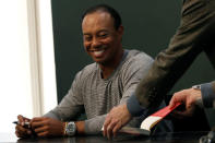 Golfer Tiger Woods sits down to sign copies of his new book "The 1997 Masters: My Story" at a book signing event at a Barnes & Noble store in New York City, New York, U.S., March 20, 2017. REUTERS/Mike Segar