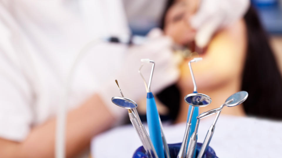 blurry photo of patient being treated by dentist. 