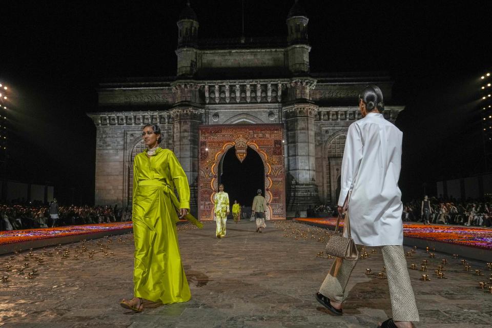 Models display creations for the Dior Pre-Fall 2023 collection at the Gateway of India landmark monument in Mumbai, India, Thursday, March 30, 2023. (AP Photo/Rafiq Maqbool)