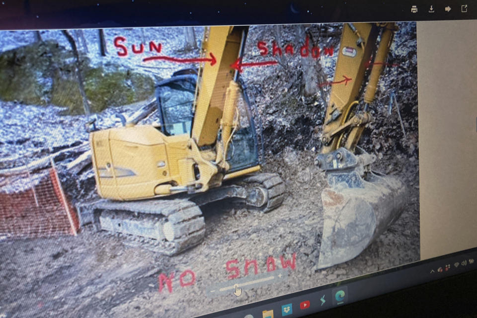 An FBI photo portraying the site of its 2018 dig for Civil War-era gold is seen on Dennis Parada's laptop in Clearfield, Pa., Friday, Jan. 6, 2023. Parada is pressing the FBI to release more documents related to the dig, which he suspects found gold but which the FBI insists came up empty. (AP Photo/Michael Rubinkam)