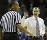 Florida head coach Billy Donovan, speaks to an official during the first half in a regional semifinal game against UCLA at the NCAA college basketball tournament, Thursday, March 27, 2014, in Memphis, Tenn. (AP Photo/Mark Humphrey)