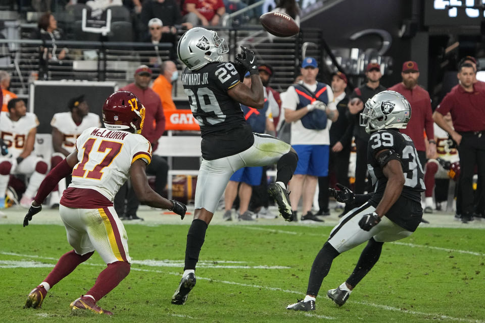 Las Vegas Raiders cornerback Casey Hayward (29) knocks a pass intended for Washington Football Team wide receiver Terry McLaurin (17) out of the air before an interception by Las Vegas Raiders cornerback Nate Hobbs (39) during the second half of an NFL football game, Sunday, Dec. 5, 2021, in Las Vegas. (AP Photo/Rick Scuteri)