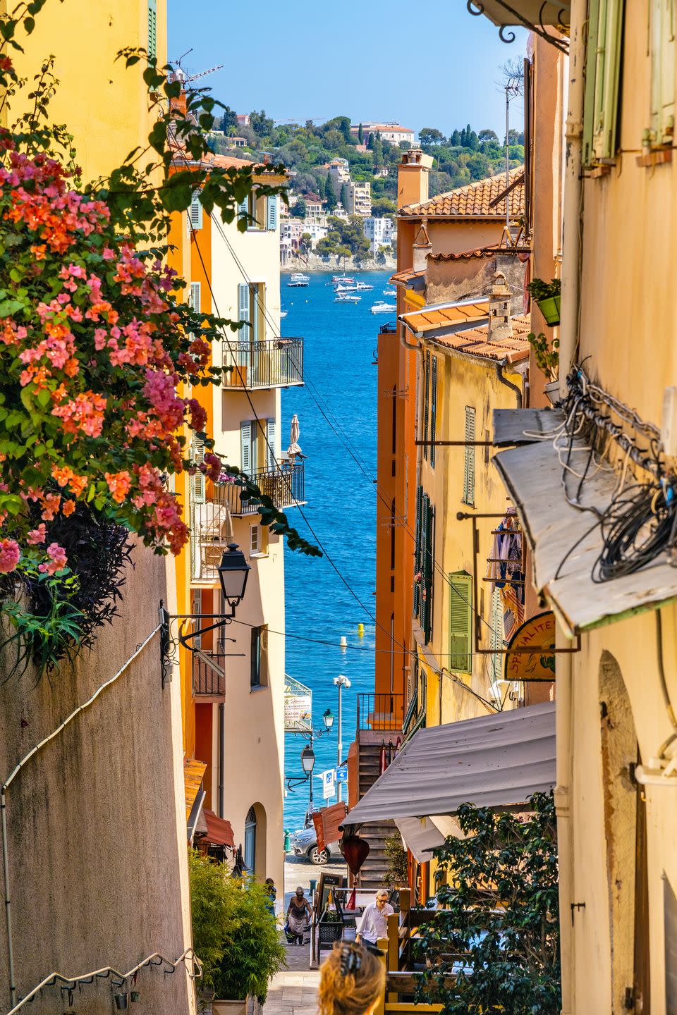 narrow streets and historic houses of old town with rue de leglise street in villefranche sur mer resort town in france