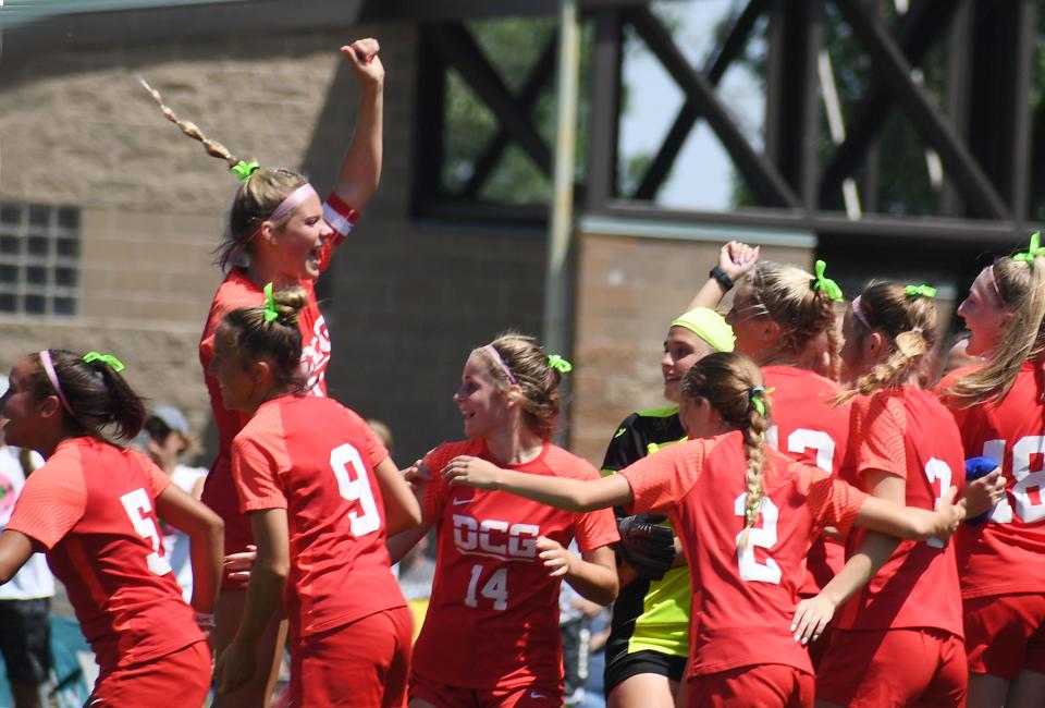 The Dallas Center-Grimes girls soccer team celebrates after defeating Cedar Rapids Xavier.
