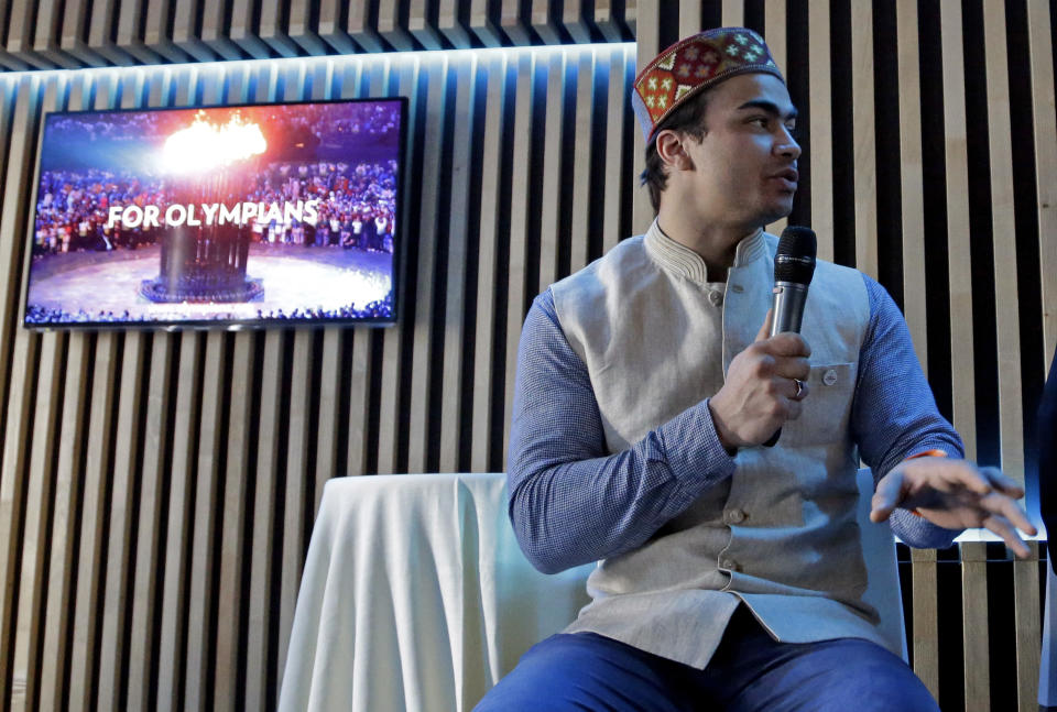 India's Shiva Keshavan speaks at a luncheon at the 2014 Winter Olympics, Tuesday, Feb. 11, 2014, in Sochi, Russia. Keshavan competed in the men's singles luge under the Olympic flag because India's Olympic body had been suspended by the IOC in 2012 over a corruption scandal. The IOC executive board reinstated the Indian Olympic body on Tuesday, Feb. 11, 2014, after it held a weekend ballot that complied with ethics rules barring corruption-tainted officials from running for election. (AP Photo/Morry Gash)