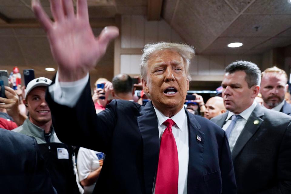 Former President Donald Trump greets supporters before speaking at the Westside Conservative Breakfast, Thursday, June 1, 2023, in Des Moines, Iowa. (AP Photo/Charlie Neibergall)