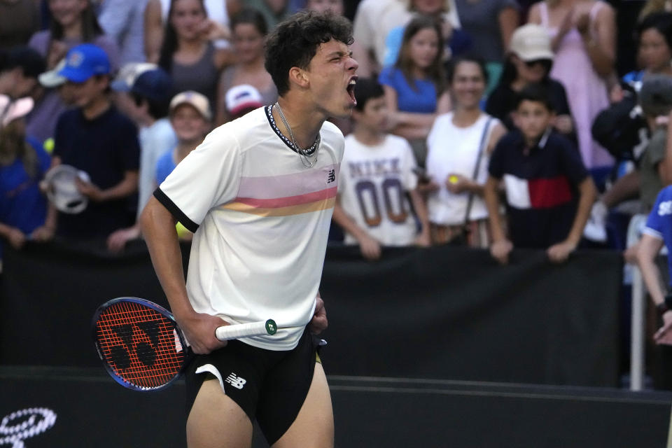 Ben Shelton of the U.S. celebrates after defeating compatriot J.J. Wolf in their fourth round match at the Australian Open tennis championship in Melbourne, Australia, Monday, Jan. 23, 2023. (AP Photo/Ng Han Guan)