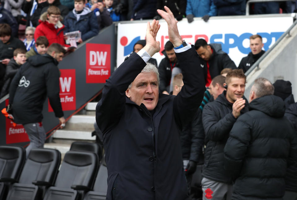 Mark Hughes applauds Southampton’s fans at Wigan