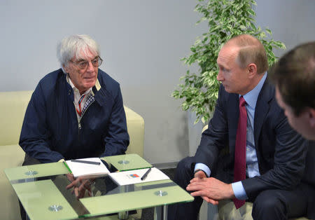 Russian President Vladimir Putin meets with Formula One supremo Bernie Ecclestone during the Formula One Russian Grand Prix in Sochi, Russia, May 1, 2016. Alexei Druzhinin/Sputnik/Kremlin via Reuters