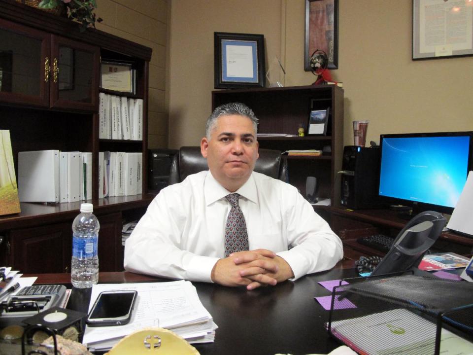 La Villa Independent School District Superintendent Narciso Garcia poses for a photo in his office in La Villa, Texas, Monday, Jan. 13, 2014. A water payment dispute between the city and school district has shut down the schools. (AP Photo/Chris Sherman)