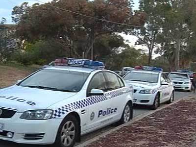 <p>Police cars line the street at the scene of the Para Hills home invasion.</p>