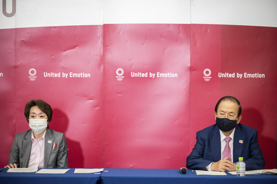 Seiko Hashimoto, president of Tokyo 2020, left, and Toshiro Muto, CEO of Tokyo 2020, attend a media huddle following the IOC Executive Board Meeting at the Tokyo 2020 headquarters in Tokyo, Wednesday, April 21, 2021. (Philip Fong/ Pool Photo via AP)