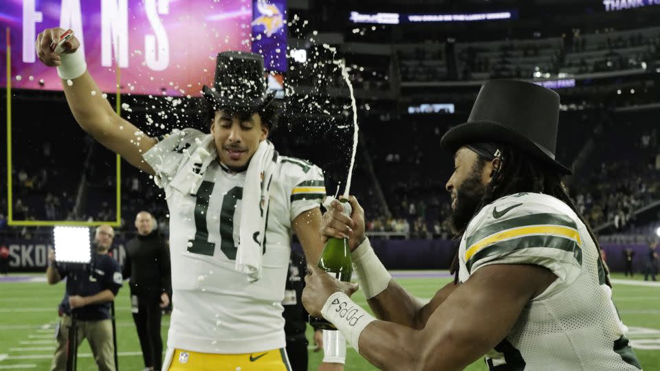 Love and Jones celebrate after beating the Vikings. - Stephen Maturen/Getty Images