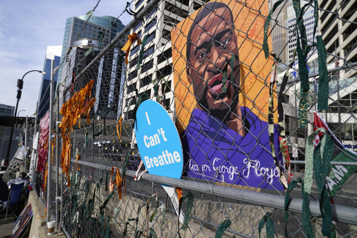 A picture of George Floyd outside the building where the Derek Chauvin trial continues. (Jim Mone/AP)