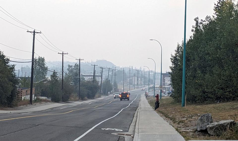 Wildfire smoke fills the air over Yellowknife on Thursday, Aug. 17, 2023. Prime Minister Justin Trudeau is expected to convene an urgent meeting with ministers and senior officials as residents of the capital of Northwest Territories are ordered to evacuate the area because of an encroaching wildfire.