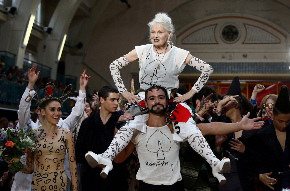 Vivienne Westwood is carried after her catwalk show at London Fashion Week Men’s 2017 (REUTERS)